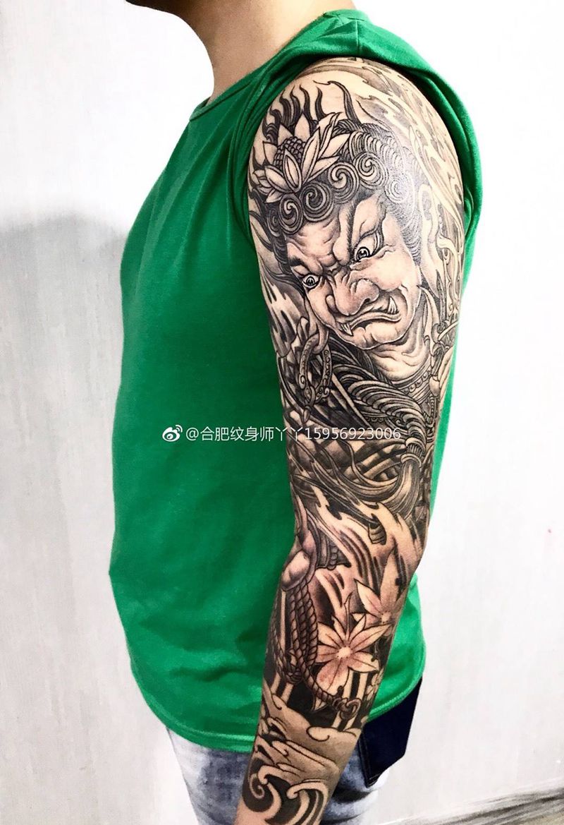 不动明王花臂纹身图片_成品手臂传统动物宗教纹身图案
