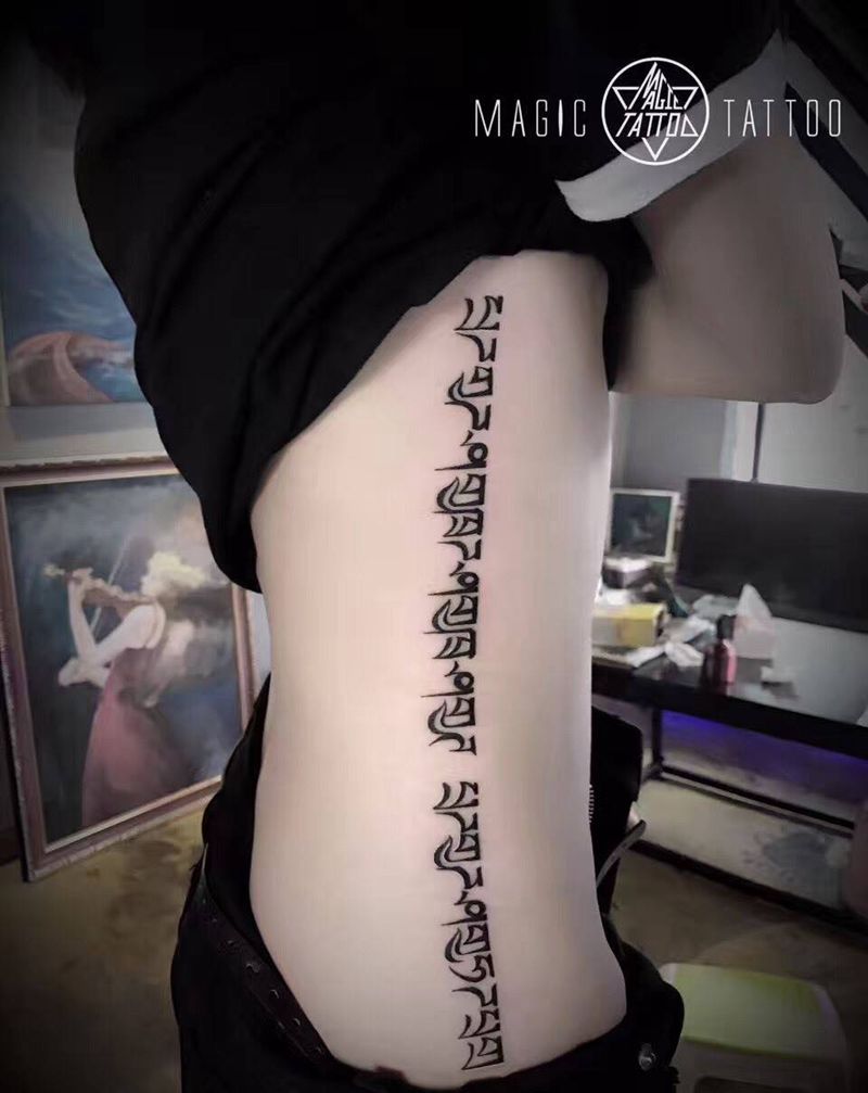 一念天堂一念地狱纹身图片_成品腰部腹部传统字符蚌埠梵文纹身图案