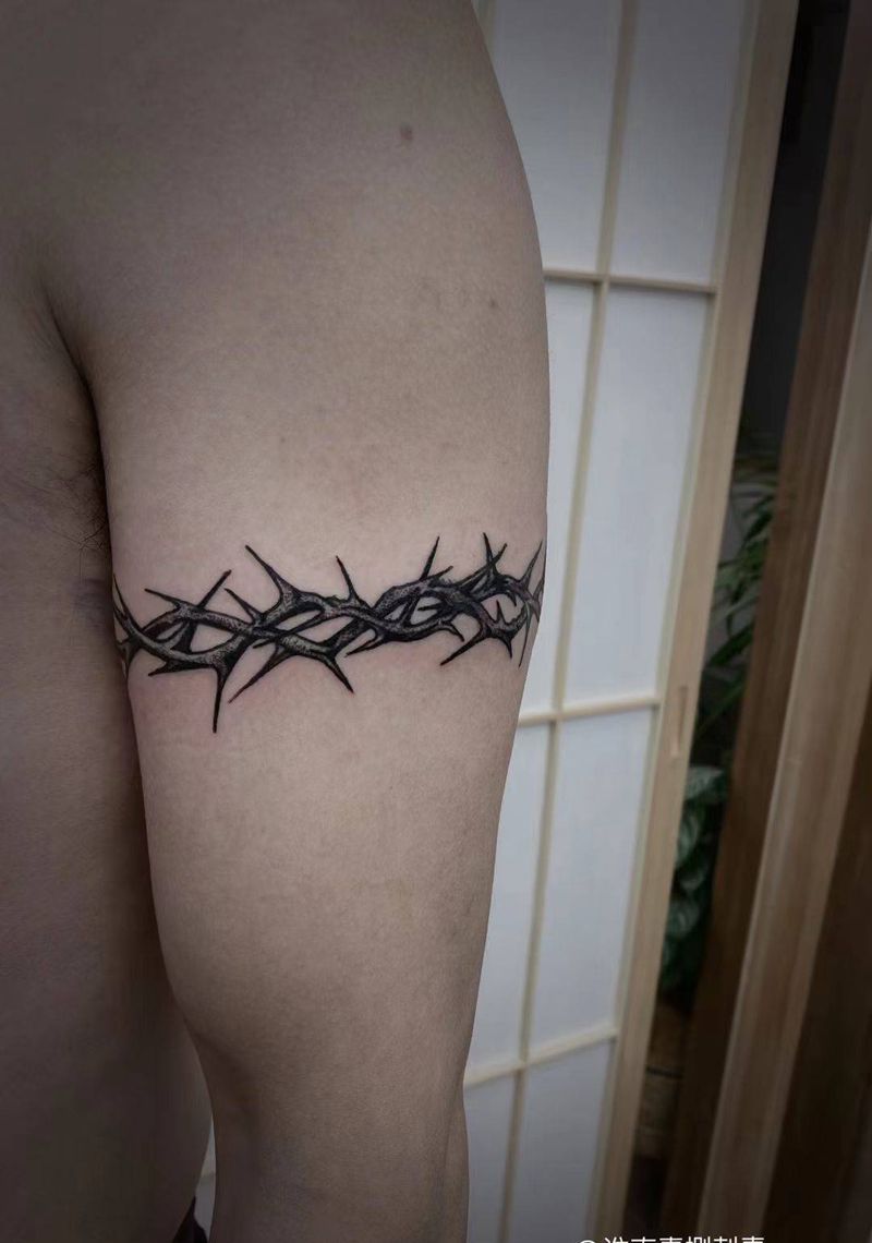 荆棘纹身图片_手臂点刺纹身图案