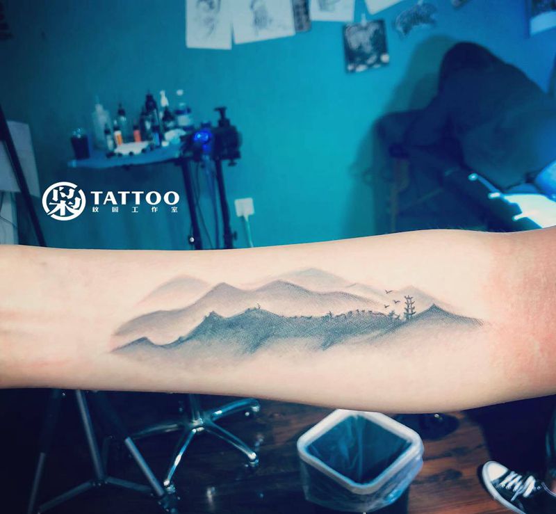 山水遮盖纹身图片_手臂纹身图案