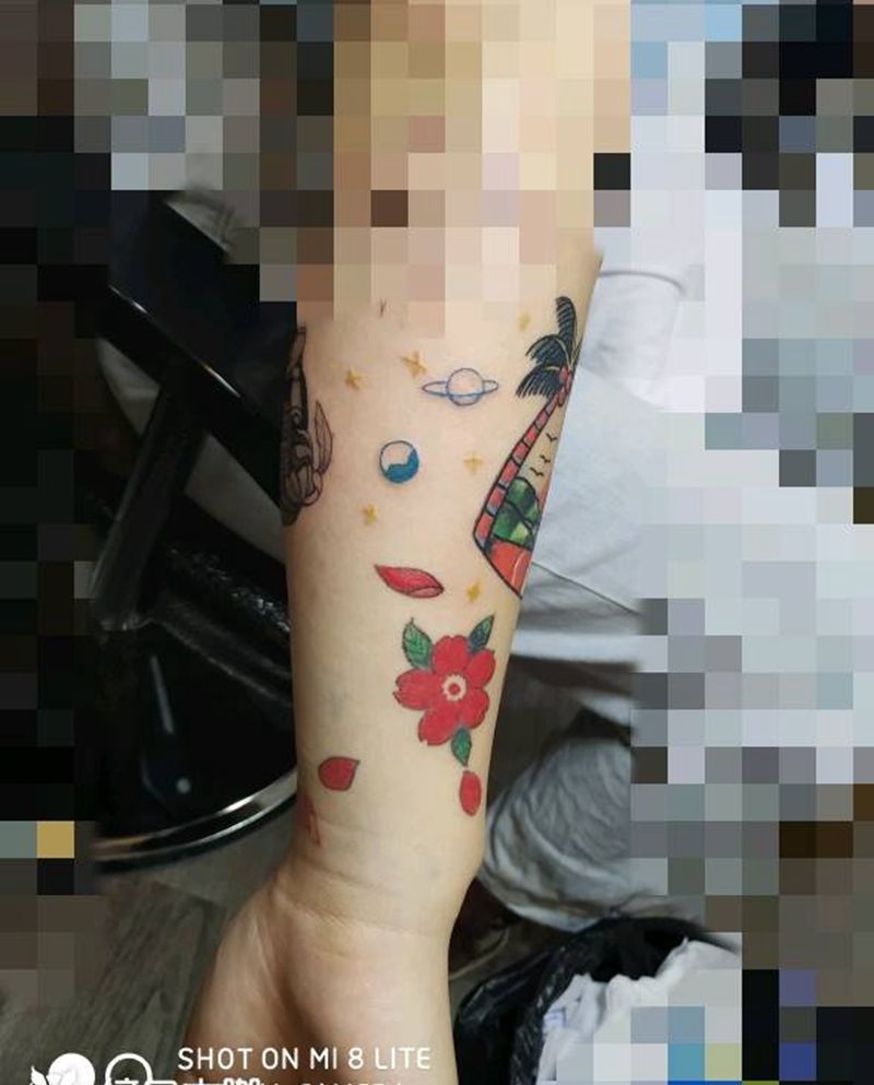 小星球纹身图片_手臂水彩纹身图案
