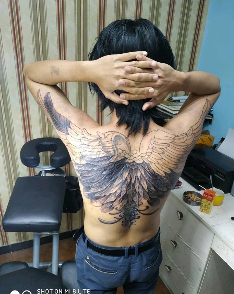 羽毛遮盖纹身图片