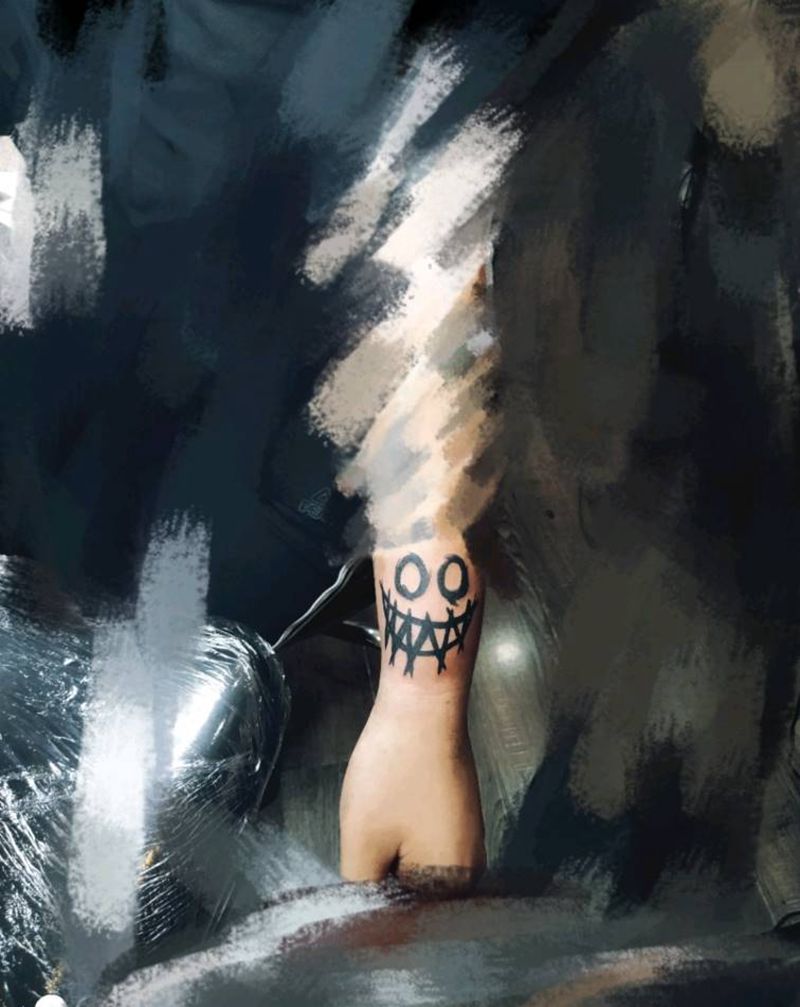 笑脸纹身图片_手臂图腾纹身图案