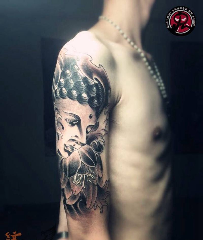 安庆小伙的大臂佛纹身图片_成品手臂传统宗教纹身图案