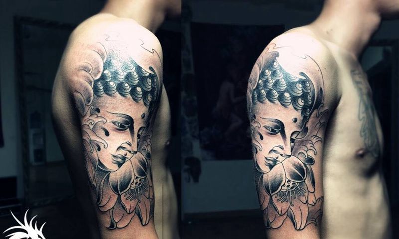 大臂佛像纹身图片