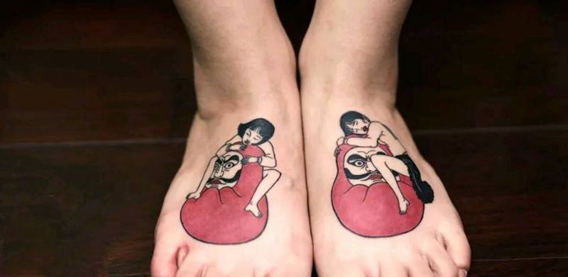 女人达摩蛋。纹身图片_脚部纹身图案