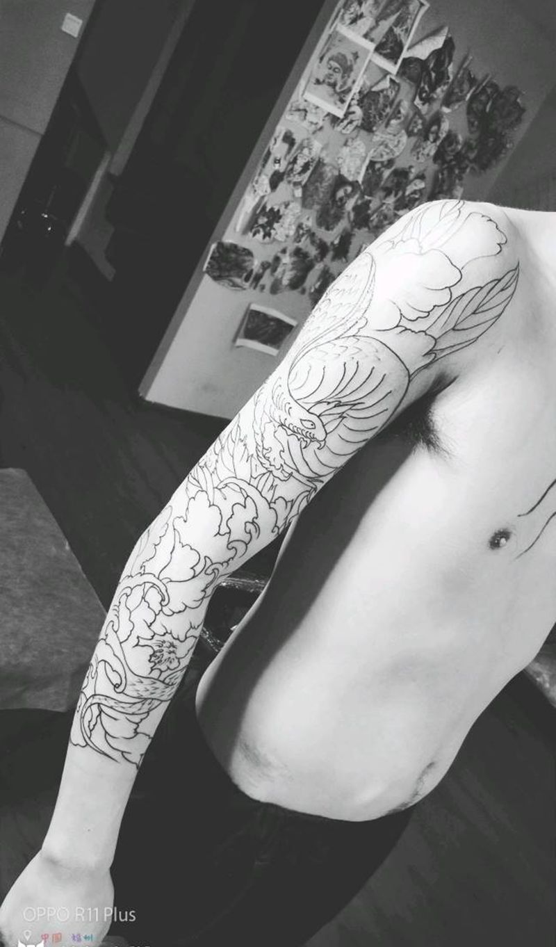 蛇戏牡丹纹身图片_手臂纹身图案