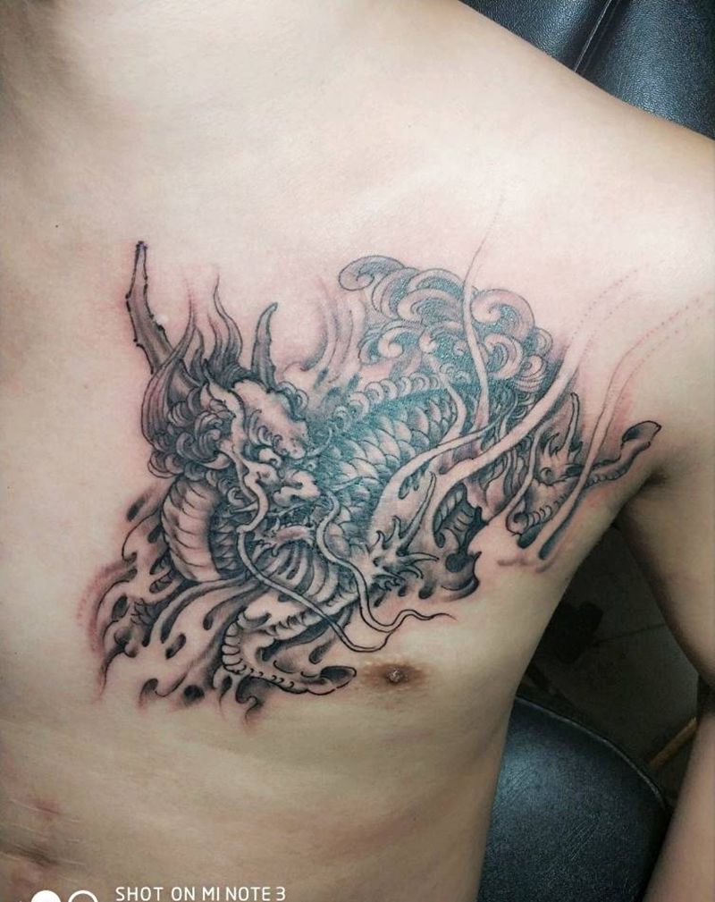 麒麟遮盖旧线条纹身图片_胸部新传统纹身图案