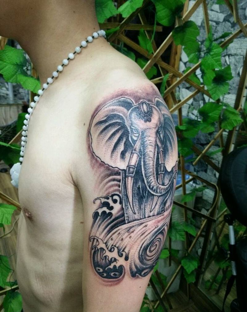 大臂吸财象纹身图片