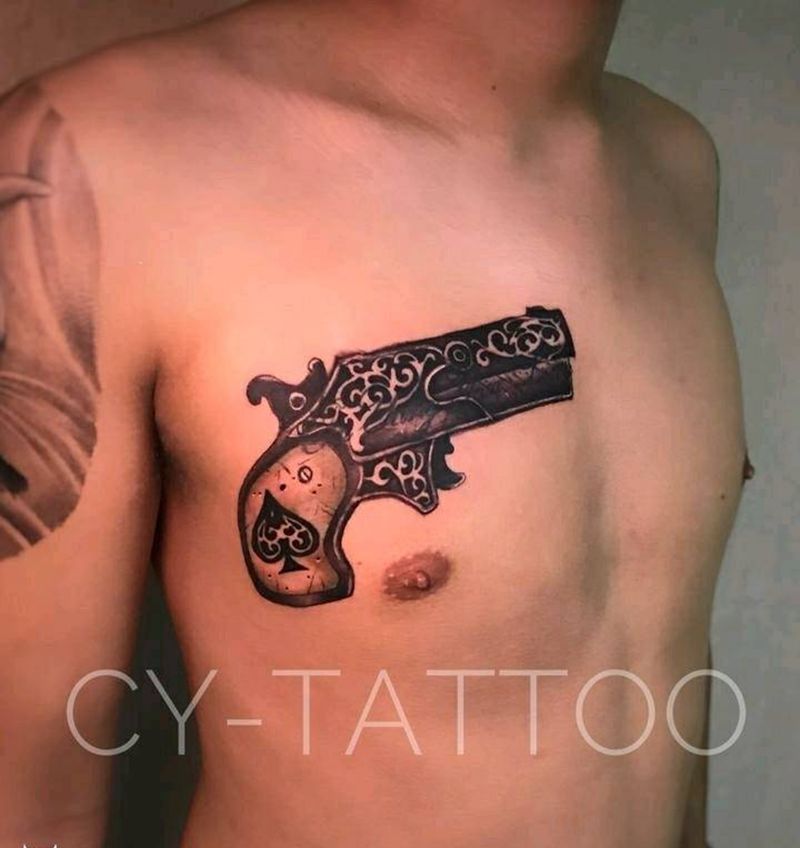 复古手枪遮盖旧英文纹身图片_胸部欧美写实静物成品纹身图案