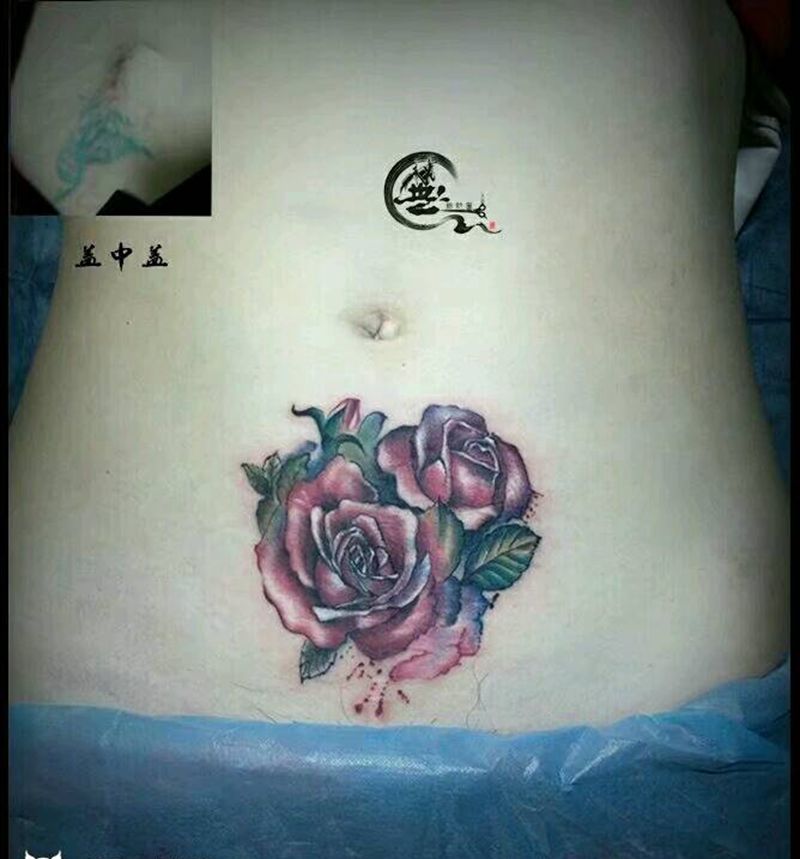 水彩花纹身图片_腹部盖中盖纹身图案