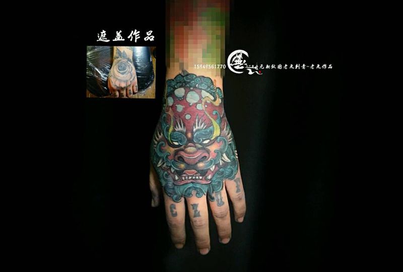 手背唐狮遮盖纹身图片_手部新传统唐狮纹身图案