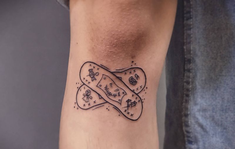 创口贴纹身图片_腿部纹身图案