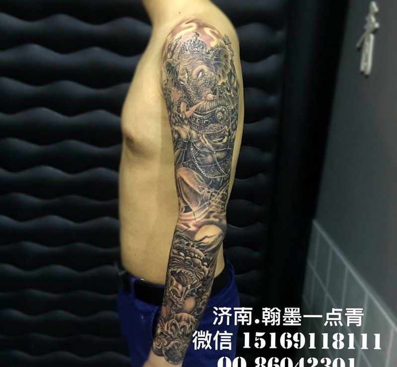 花臂纹身图片_腿部传统宗教纹身图案