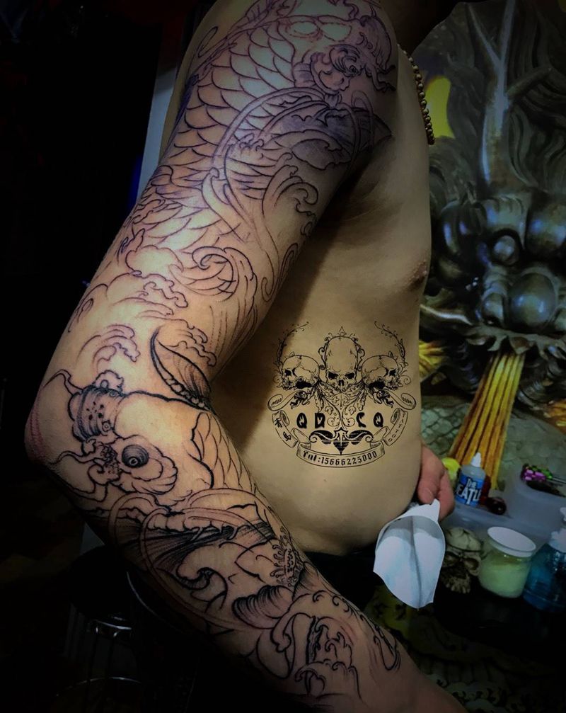 鲤鱼花臂纹身图片