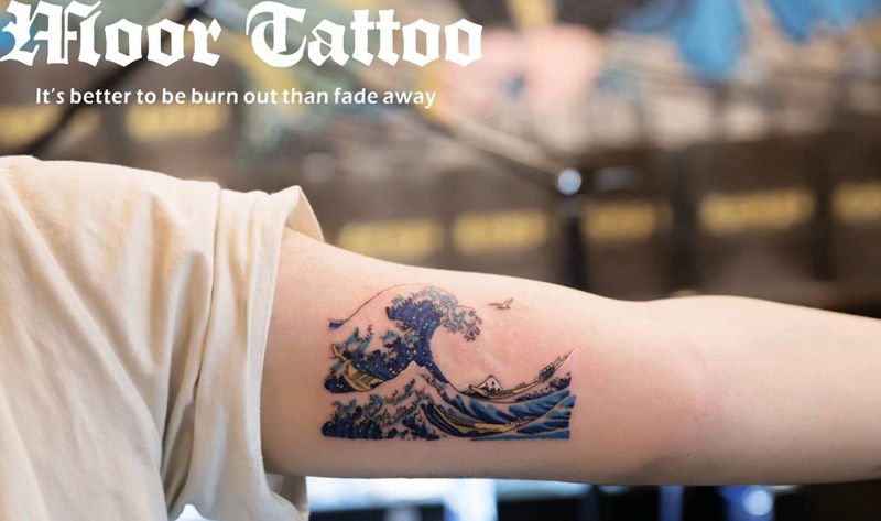 海浪纹身图片_手臂成品纹身图案