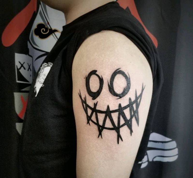 黑暗笑脸纹身图片_手臂图腾纹身图案