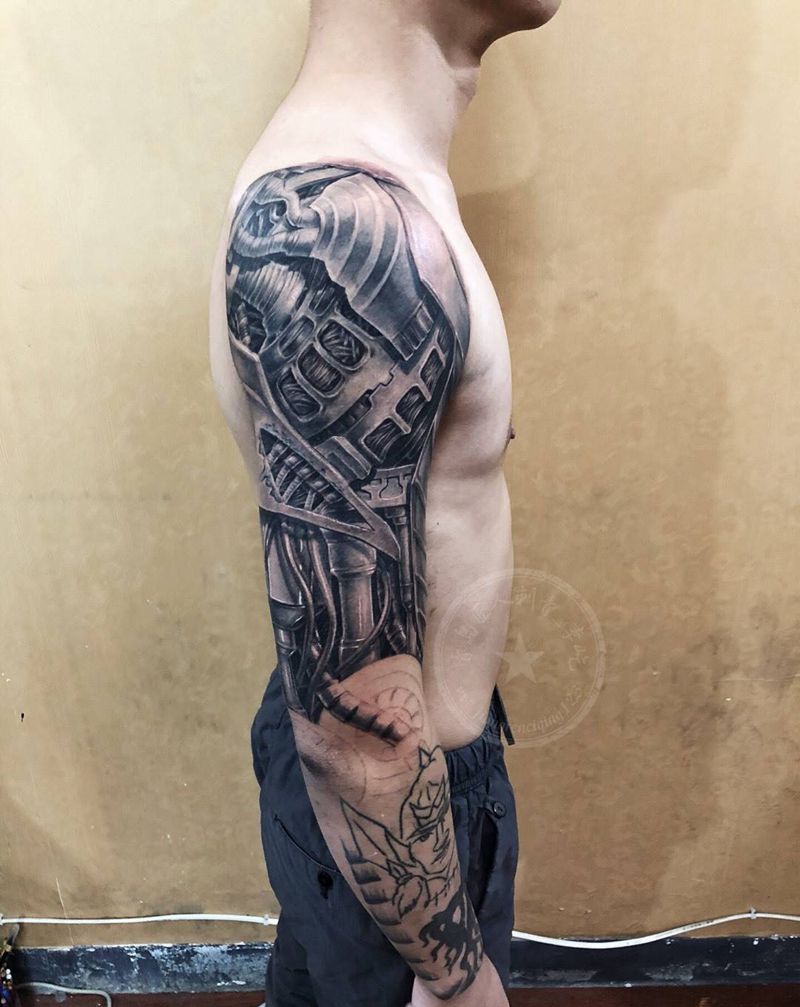 机械臂遮盖纹身图片_手臂欧美写实机械纹身图案