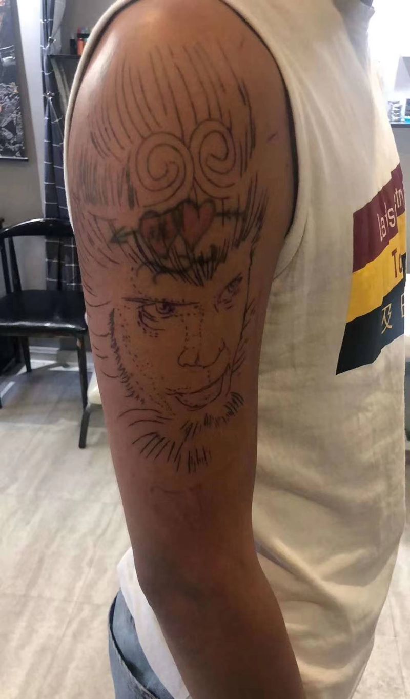 至尊宝遮盖纹身图片_手臂纹身图案