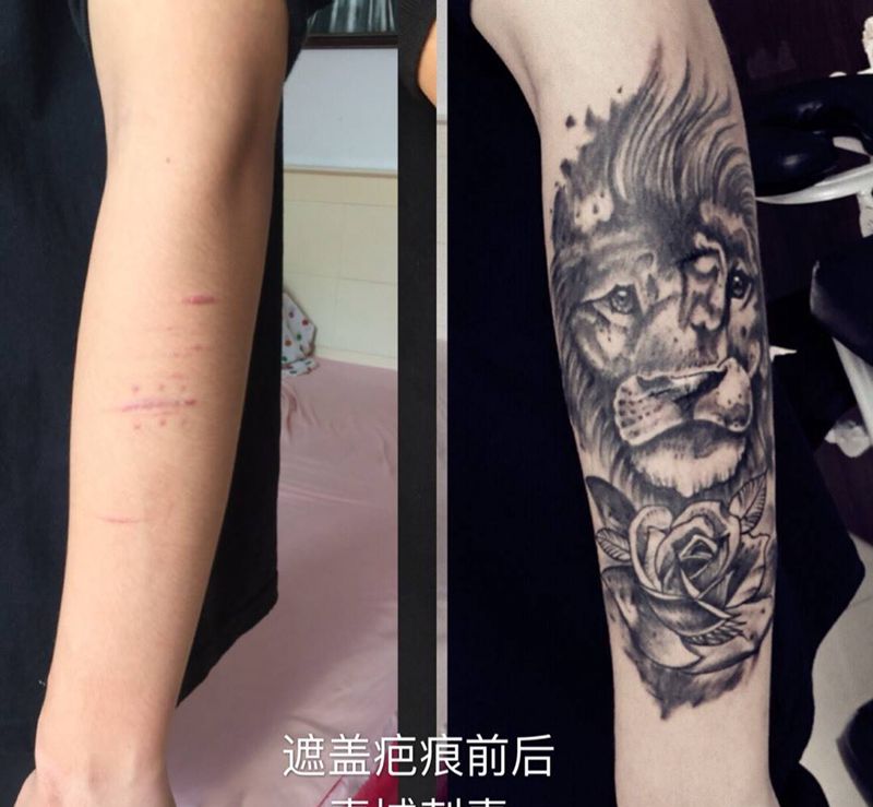 狮子遮盖疤痕纹身纹身图片_手臂欧美写实水墨纹身图案