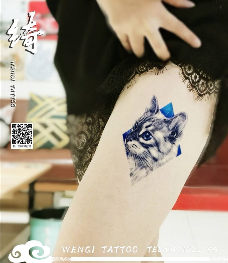 喵星人纹身图片_腿部欧美写实纹身图案