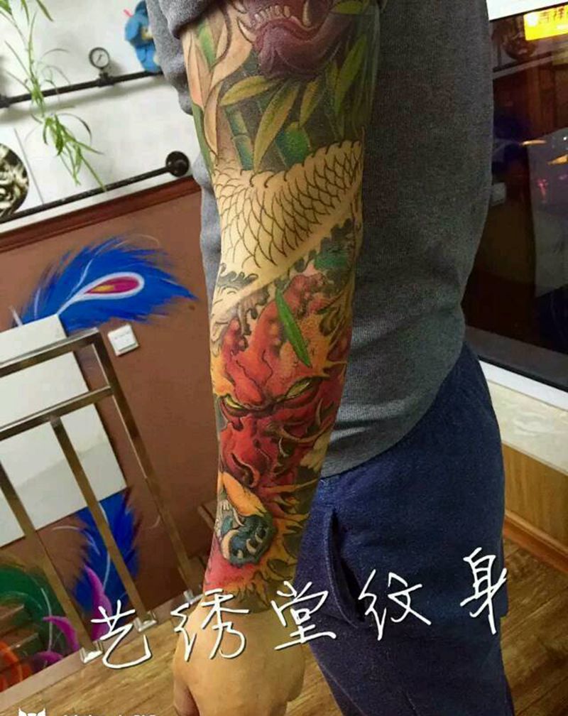 花臂龙进程纹身图片