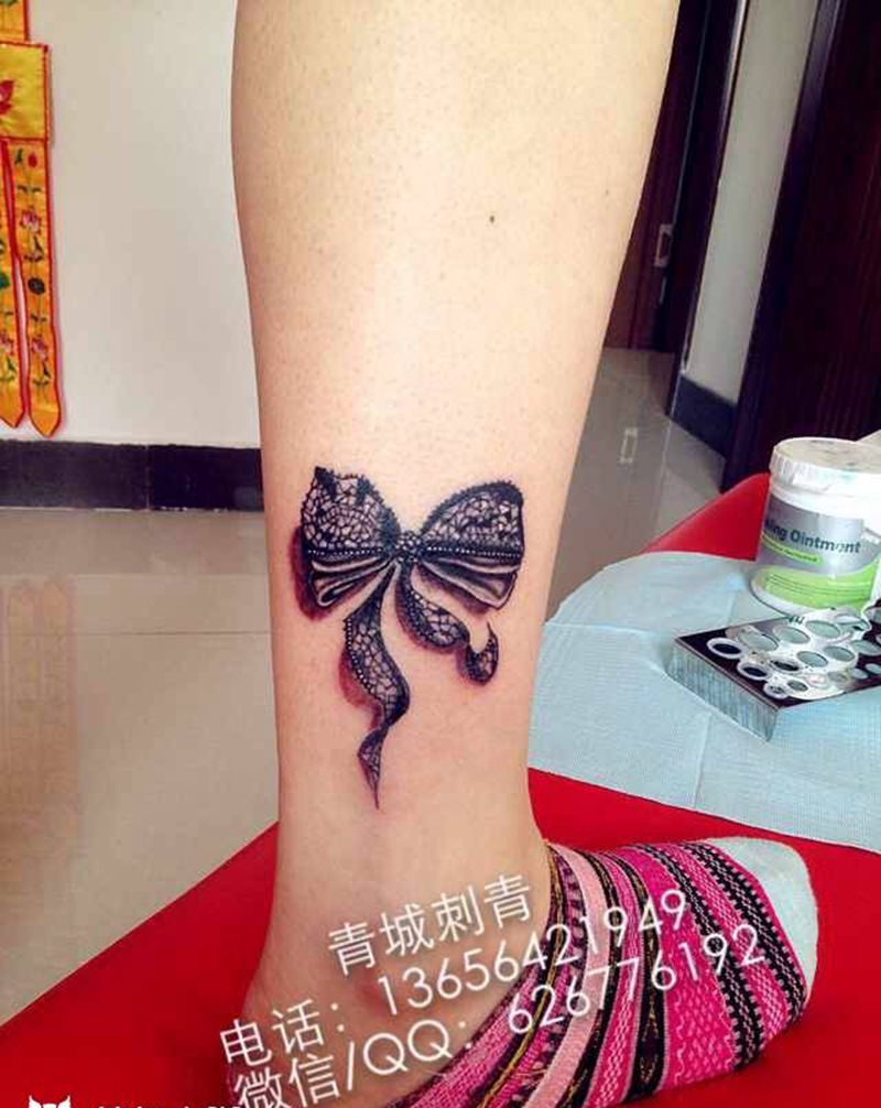 蝴蝶结纹身纹身图片_成品腿部传统写实静物纹身图案