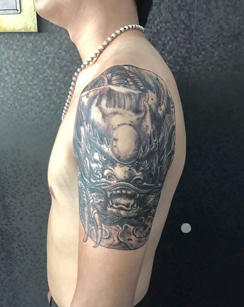 大臂龙头纹身图片