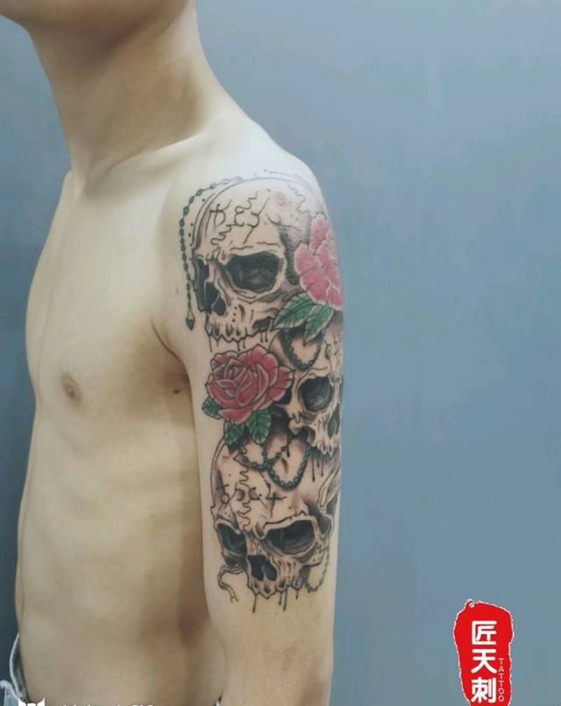骷髅 花纹身图片_手臂欧美写实纹身图案