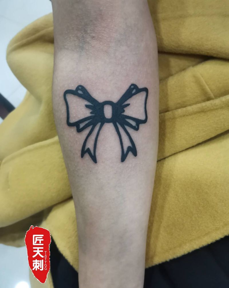 蝴蝶结纹身图片_手臂图腾水墨纹身图案