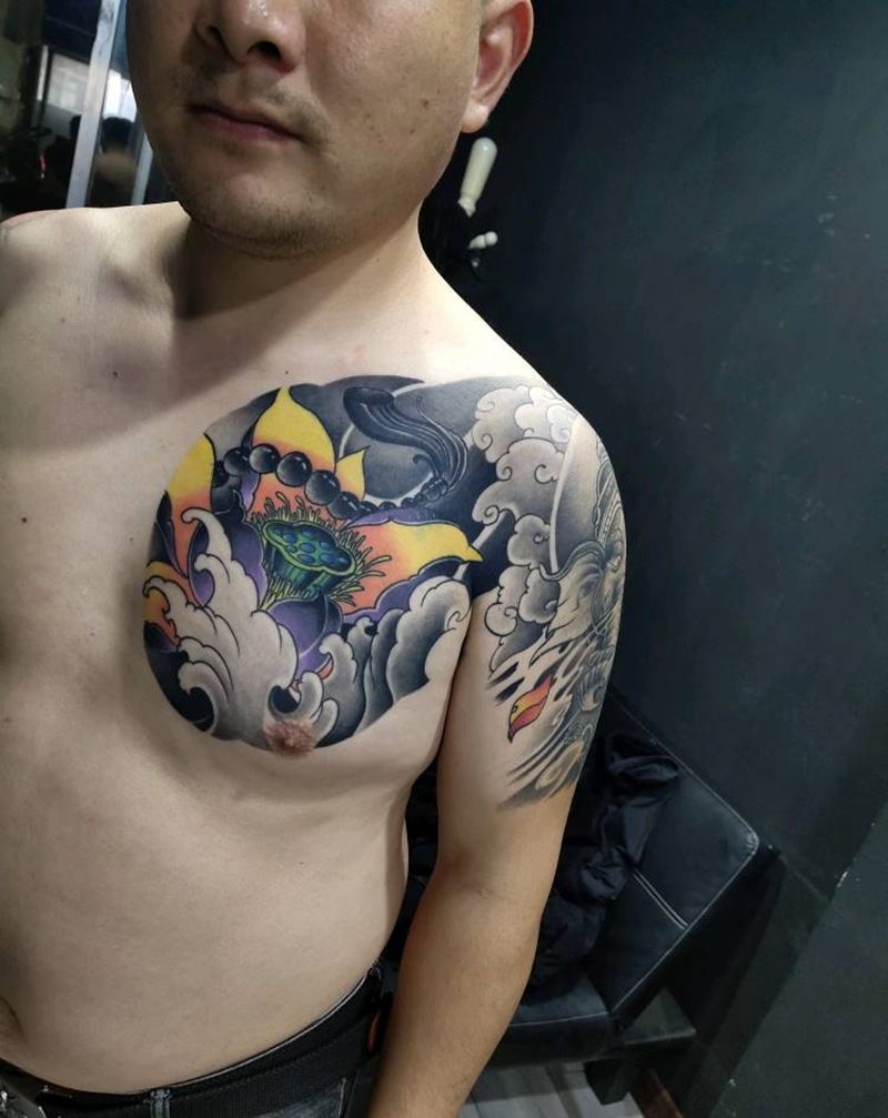 半甲荷花象神纹身图片_胸部手臂新传统荷花象神纹身图案