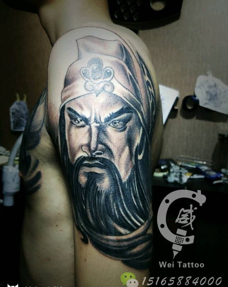 持刀关公纹身图片