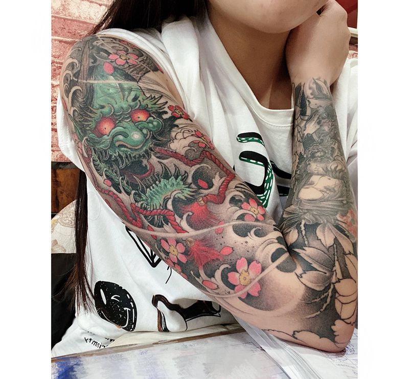 客返图纹身图片_手臂新传统纹身图案