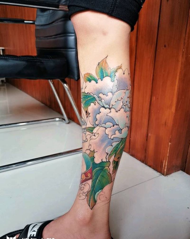 雾霾蓝牡丹纹身图片_腿部新传统纹身图案