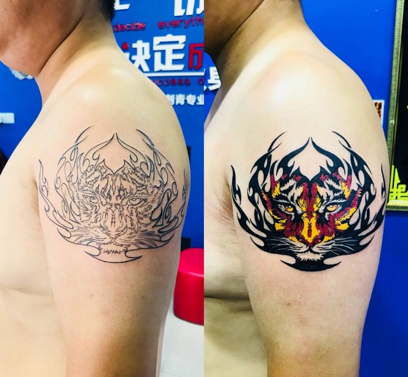 大臂虎头纹身图片