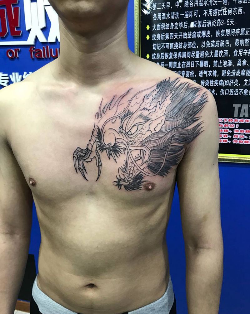 胸前龙头线条纹身图片