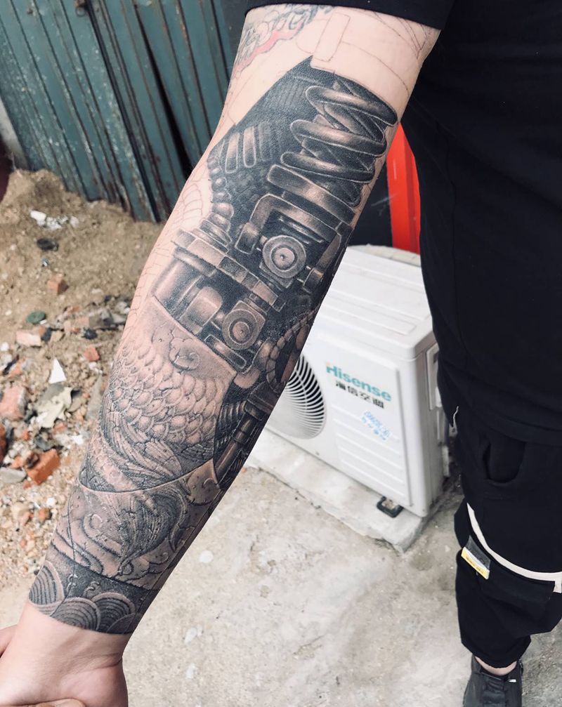 雕龙臂纹身图片_手臂欧美写实石雕机械纹身图案