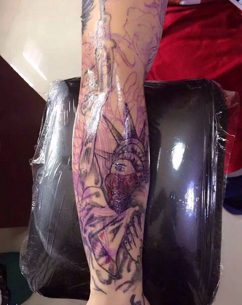 自由女神遮盖纹身图片_手臂动物纹身图案