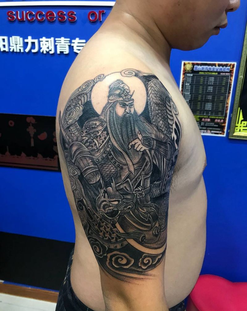 大臂关公踏龙纹身图片