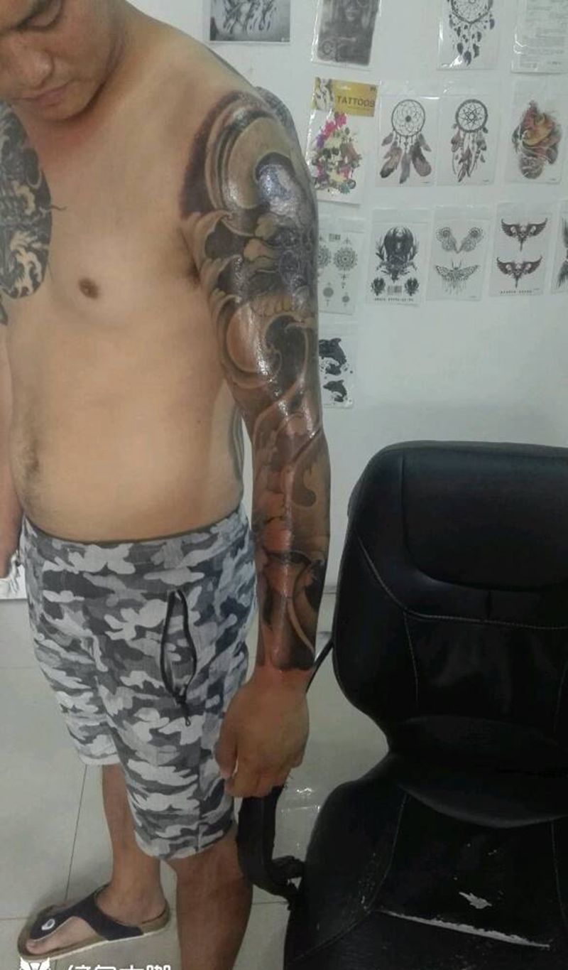 牡丹浪臂完活纹身图片