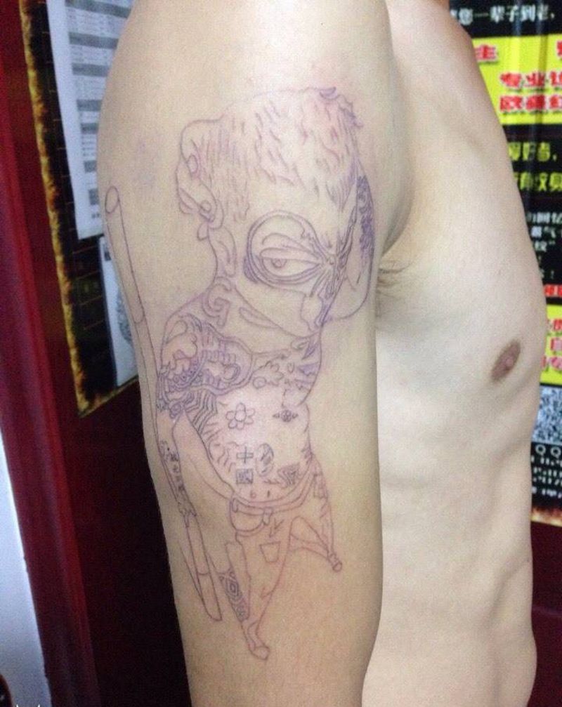 大臂社会猴纹身图片_手臂动物传统纹身图案