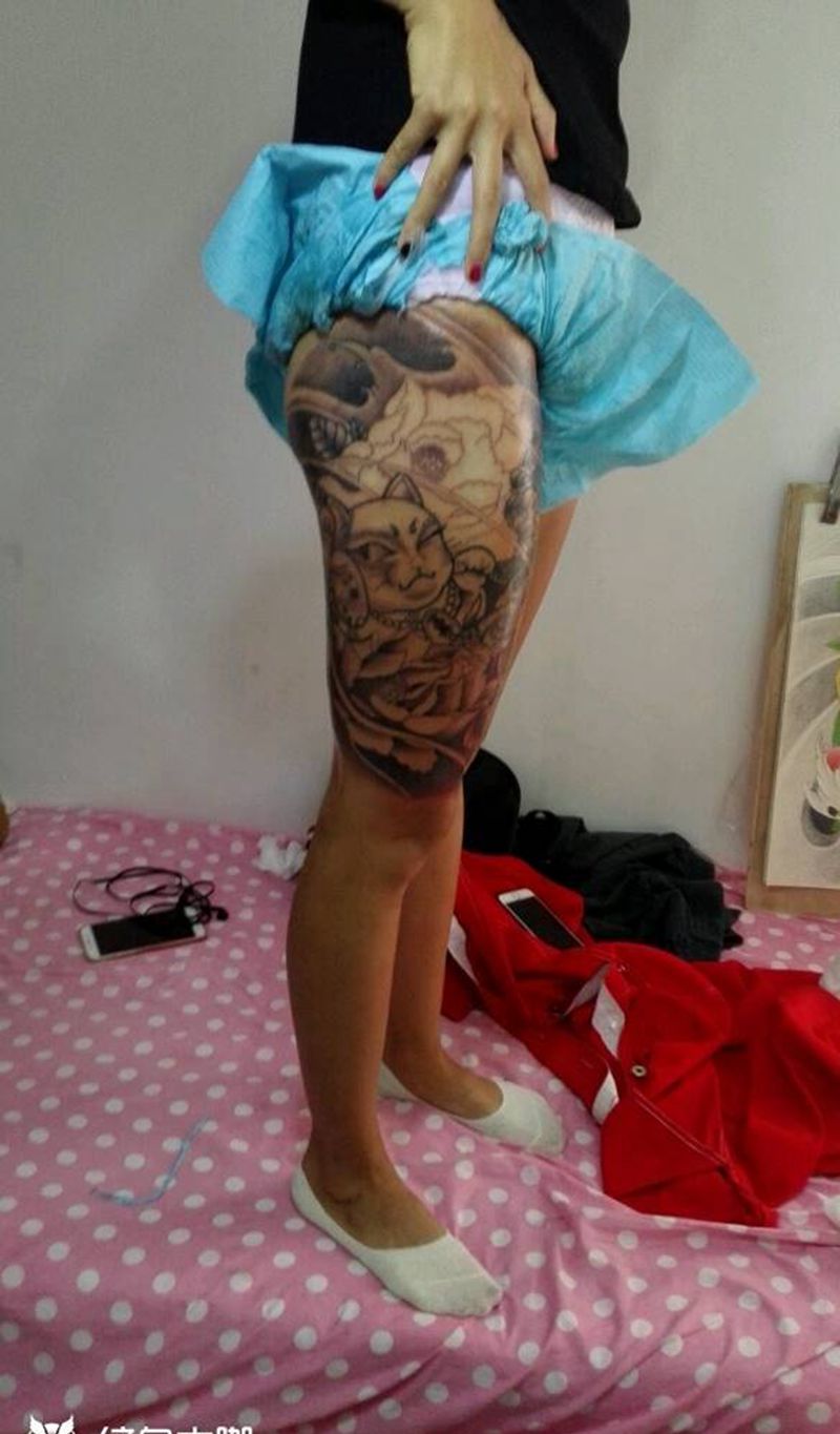 大腿招财猫未完待续纹身图片