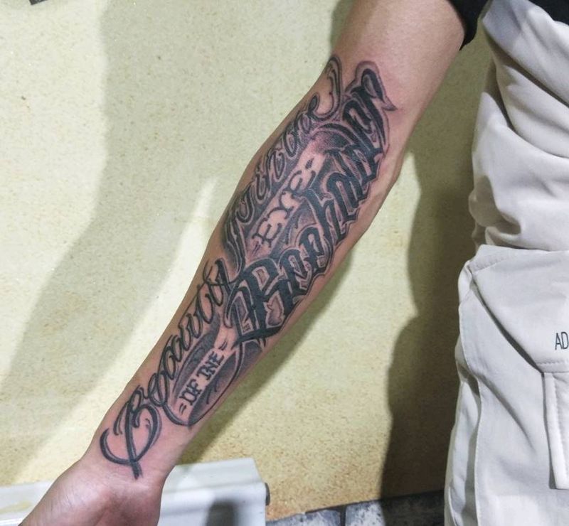 卡奇诺花体纹身图片_手臂花体字纹身图案