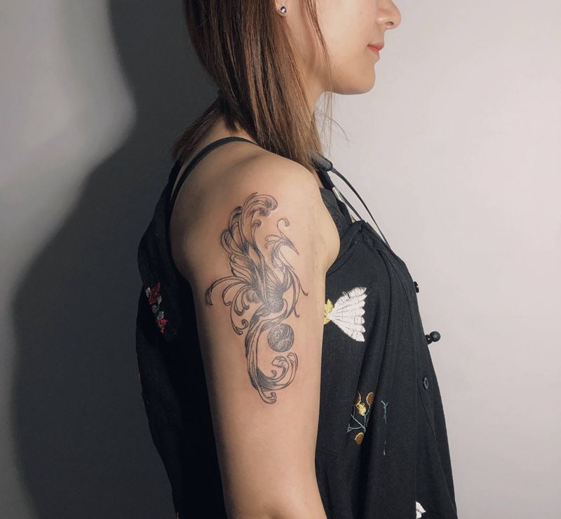 图腾凤纹身图片_手臂图腾凤凰纹身图案