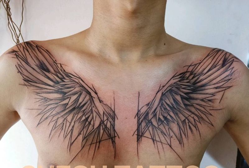 翅膀纹身图片_胸部水墨纹身图案