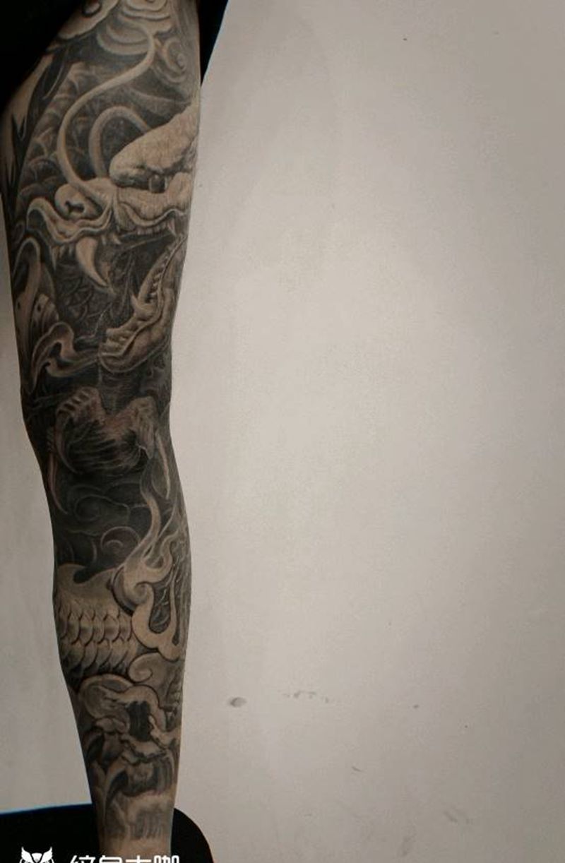 石雕花腿龙纹身图片_腿部纹身图案