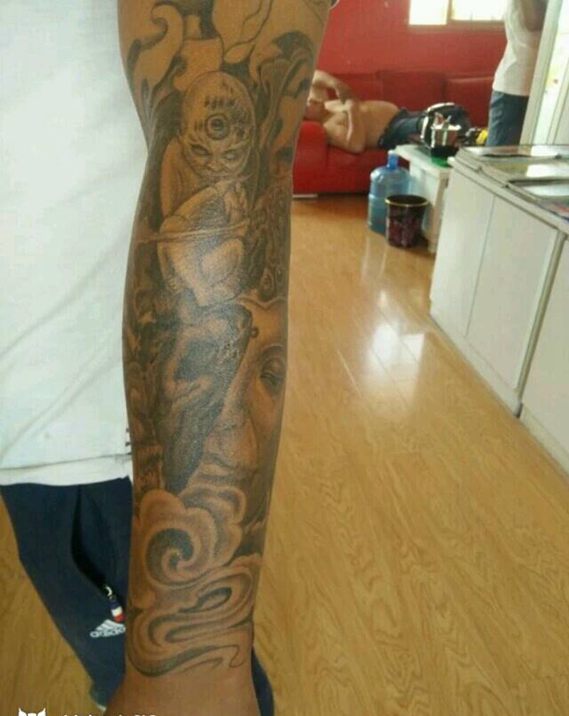 小臂佛与魔纹身图片