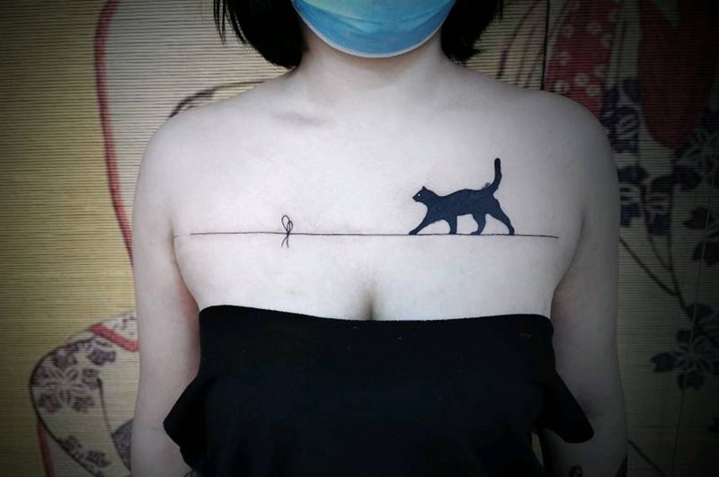 猫咪遮盖纹身图片_胸部纹身图案