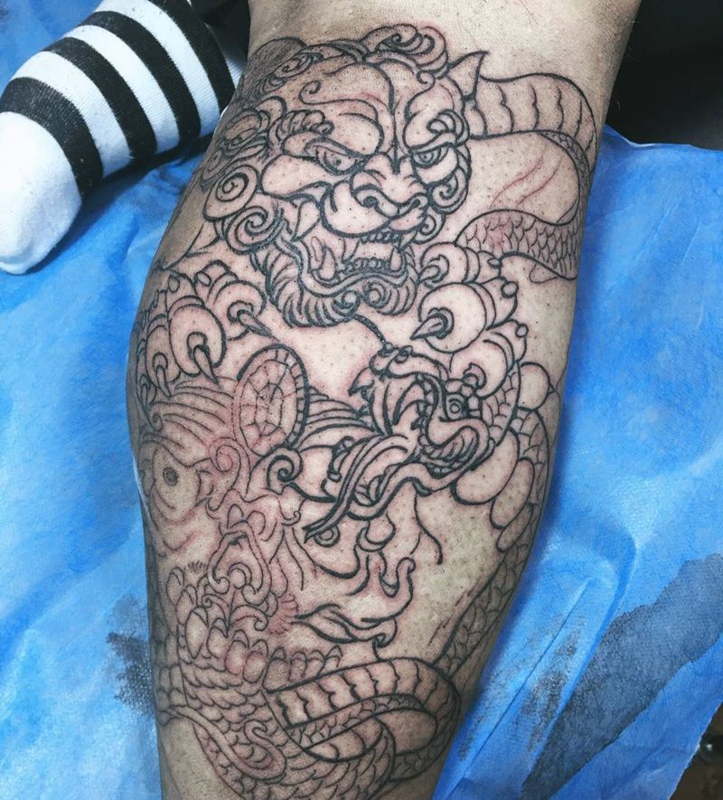 嘎巴拉➕唐狮子➕蛇纹身图片_成品腿部传统宗教动物纹身图案