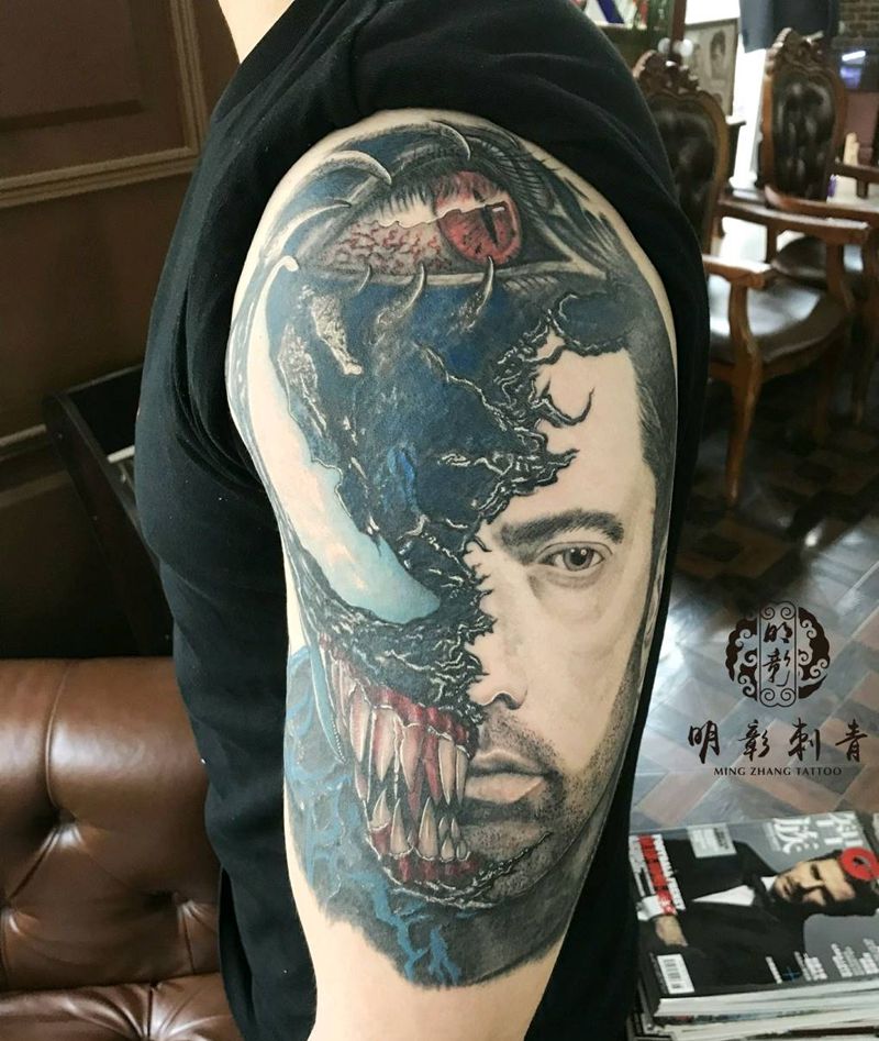 毒液题材＋歌手阿姆＋生化眼睛纹身图片_手臂欧美写实纹身图案